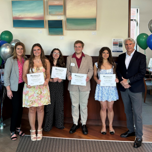 BankGloucester President Patrick Thorpe and Vice President Amy Mitchell presenting the 2026 graduates with their scholarships in the BankGloucester lobby.